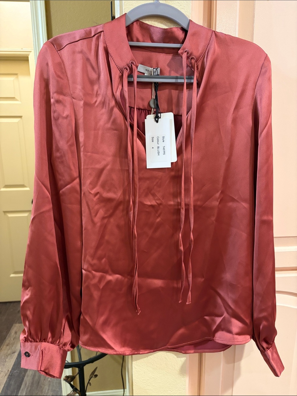 IRIS INK blush Satin Tie-Front Blouse quite shimmery and elegant.